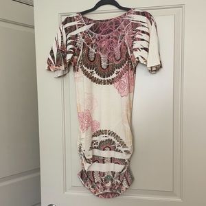 Mini v neck dress with roucheing on the sides.